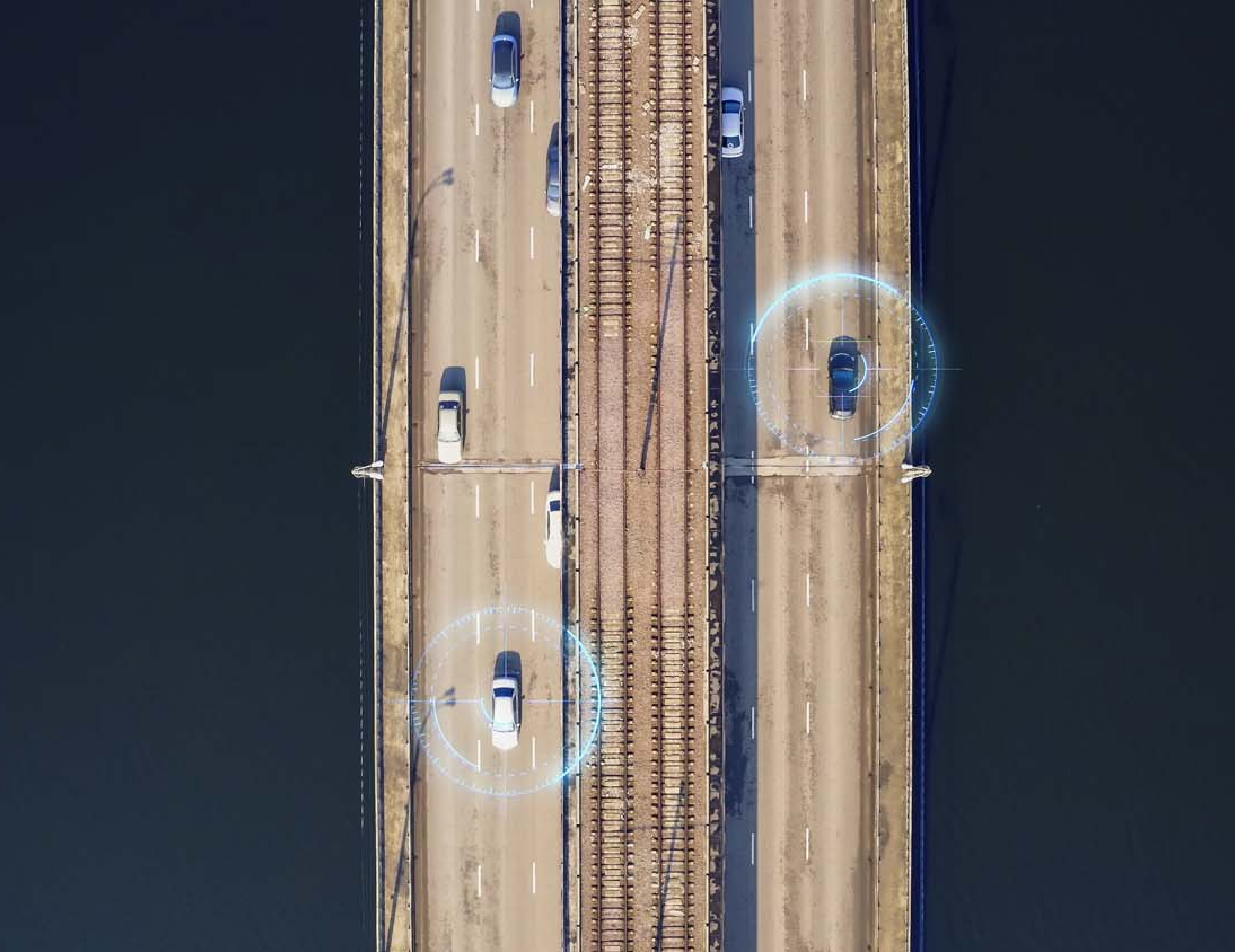 Aerial top view of autonomous self driving cars on city bridge (1)